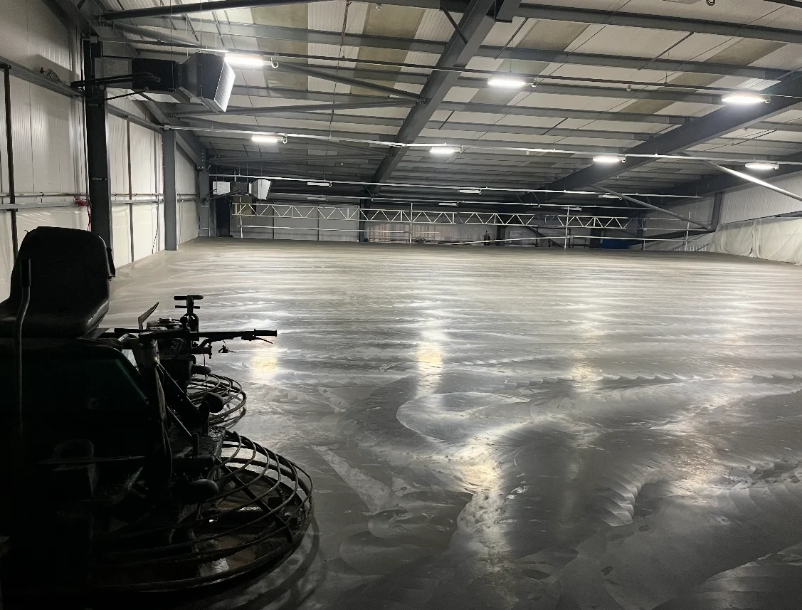 Power float concrete finish in warehouse