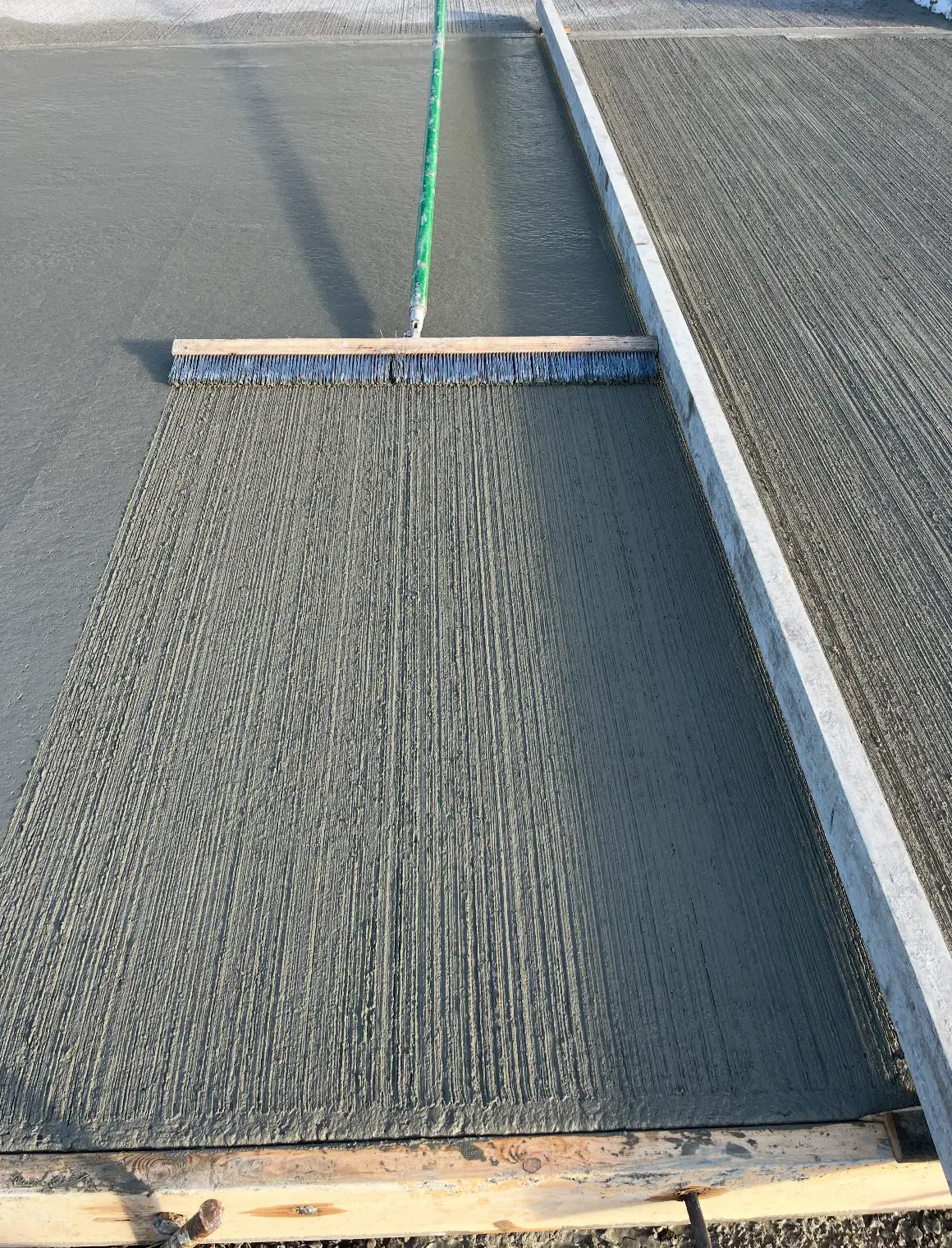 Brush finish concrete yard providing non-slip surface for farms in North Wales
