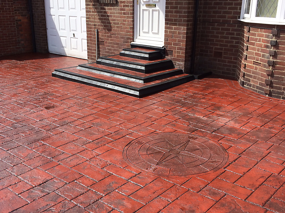 Patterned imprinted concrete driveway installation